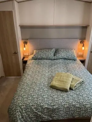 a bed in a bedroom with two pillows on it at Deblisa in Longtown