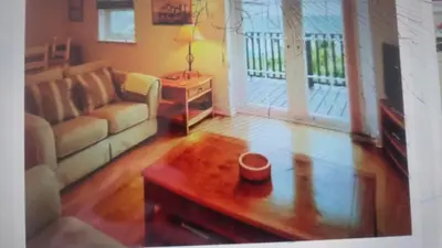 a living room with a couch and a coffee table at Ocean View in Port William
