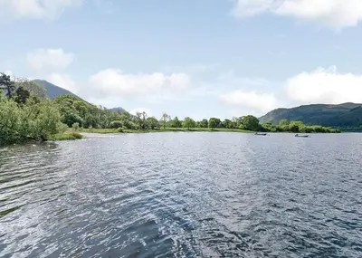 a view of a river with boats on it at Bassenthwaite Lakeside Lodges in Bassenthwaite