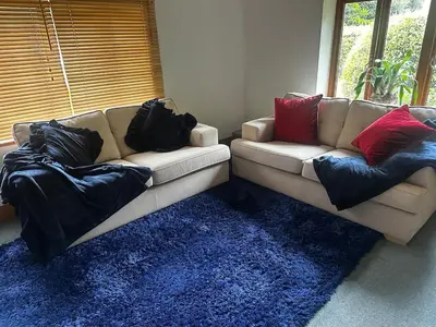 a living room with a couch with pillows on it at The Dairy in Moffat