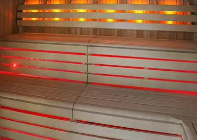 a bench with red lights on top of it at Stanwix Park in Silloth