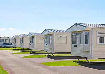 a row of mobile homes parked in a row at Stanwix Park in Silloth