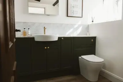 a bathroom with a sink and a toilet at The Farmhouse at Highside Farm in Bassenthwaite