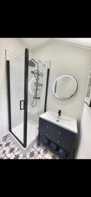 a bathroom with a sink and a mirror at Kirkgate 2 bed - Coorie Doon Stays in Irvine
