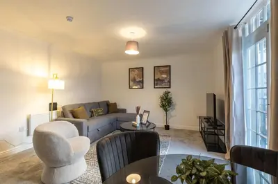 a living room with a couch and a table at Lovely 2BED Whitehaven Apartment with Sea Views in Whitehaven
