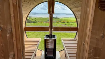 an inside view of a room with an open window at Ardwall in Carsluith