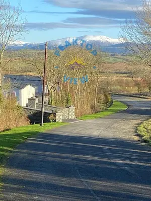 an empty road with a sign that says marry at Peaktop View, Winscales, near Cockermouth Cumbria in Winscales