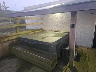 a mattress sitting on a platform in a building at Sandylands in Braystones