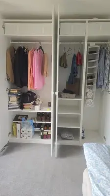 a walk in closet with white shelves and clothes at Luxury Spacious Double Room, Mill Hill, London NW7 3BD in Moffat