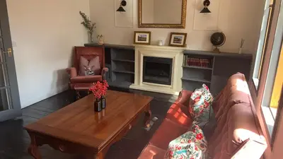 a living room with a couch and a coffee table at Close to beaches and golf courses in Maybole