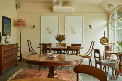 a dining room with wooden tables and chairs at Victorian House in Grasmere