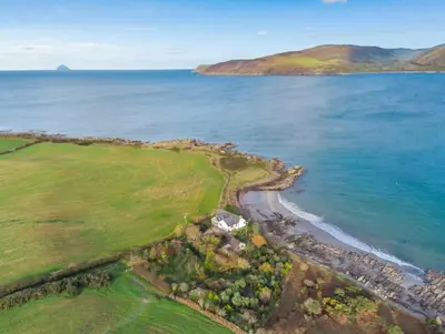 an aerial view of a beach and the ocean at 3 Bed in Kirkcolm oc-b34009 in Kirkcolm