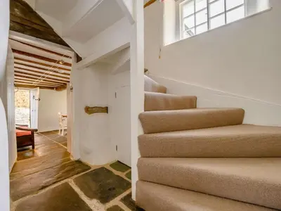 a staircase in a house with a window at 4 Bed in Nr Keswick oc-sz231 in Braithwaite