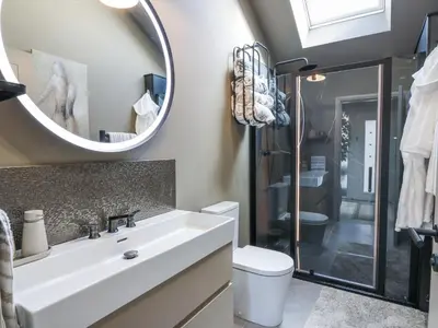 a bathroom with a sink and a mirror at Scotia At The Brig in Annan