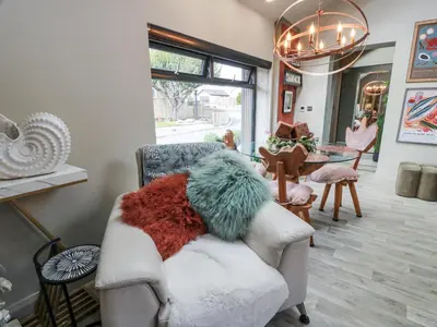 a living room with a chair and a table at Scotia At The Brig in Annan