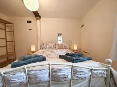 a bedroom with a bed with two pillows on it at 2 Bed in Wigton oc-b34112 in Caldbeck