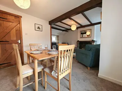 a dining room with a wooden table and chairs at 2 Bed in Wigton oc-b34112 in Caldbeck