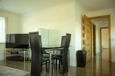 a dining room with a table and chairs at 3 bedroom luxury Apartment in Prestwick