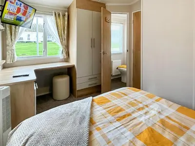 a bedroom with a bed and a window at Rorys Retreat - Ukc7144 in Ayr