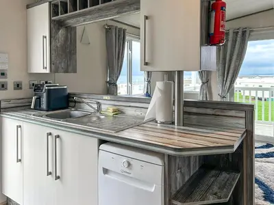a kitchen with a sink and a counter top at Ocean Bay View - Ukc7143 in Ayr