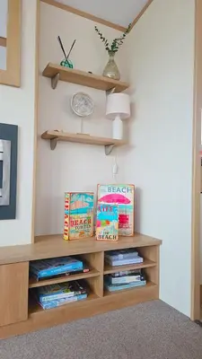 a book shelf in a room with books at Ruby Atlas Monreith in Monreith