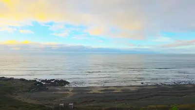 a view of the ocean on a cloudy day at Ruby Atlas Monreith in Monreith