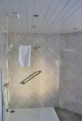 a shower with a glass door in a bathroom at The Hopetoun Arms Hotel in Leadhills