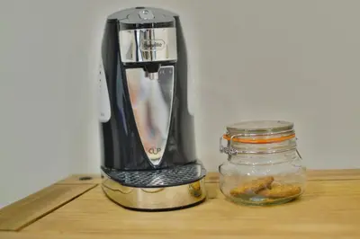 a coffee maker sitting on a counter next to a glass jar at The Hopetoun Arms Hotel in Leadhills