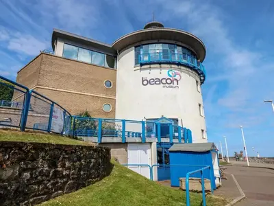 a building with a sign on the side of it at Bardywell Penthouse - 2 Bedrooms - Sleeps 4 in Whitehaven