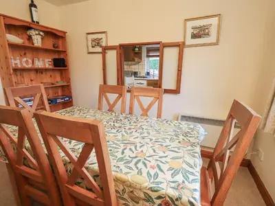 a dining room with a table and chairs at Thrang View in Ambleside