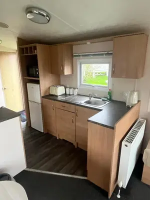 a small kitchen with a sink and a counter at MaCEIDEIRD in Mainsriddle