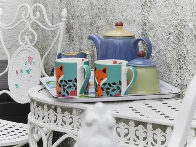 a tray with cups and a teapot on a table at 2 Bed in Cockermouth oc-sz431 in Bassenthwaite Lake