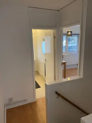 a hallway with a door leading into a room at Entire 4 bedrooms Apartment Sleep 8 Central London ZONE1 in Moffat