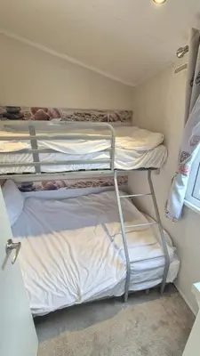 two bunk beds in a small room at Caravan Bliss in Minishant