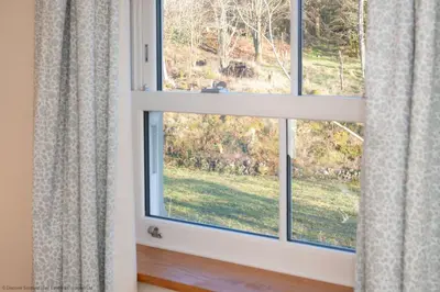 a window with a view of a yard at Craignair in Castle Douglas