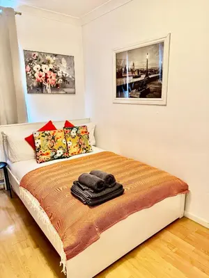 a bedroom with a bed with towels on it at Entire 1 bedroom in VAUXHALL Central London Zone 1 in Moffat