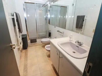 a white bathroom with a sink and a toilet at Chapel Hill in Carlisle