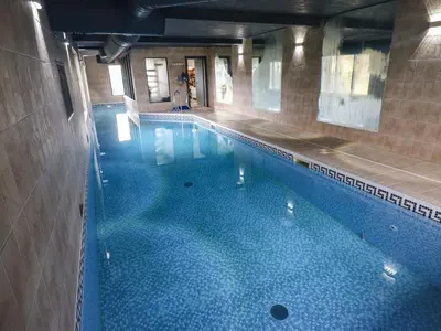 an overhead view of a swimming pool in a building at Chapel Hill in Carlisle