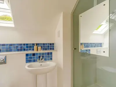 a bathroom with a sink and a shower at 3 Bed in Holmrook oc-sz537 in Beckfoot