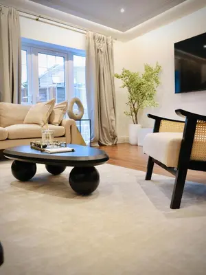 a living room with a couch and a coffee table at Premium 4BR I Near Golf Course I Fast Wi-Fi & Free Parking in Moffat