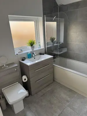 a bathroom with a sink and a toilet and a shower at Rowe Terrace Workington in Workington