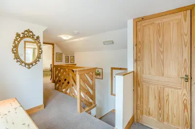 a room with a wooden door and a staircase at 3 Bed in New Galloway oc-r34387 in New Galloway