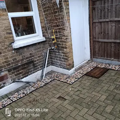 a front door of a house with a cobblestone walkway at Room2let in Moffat
