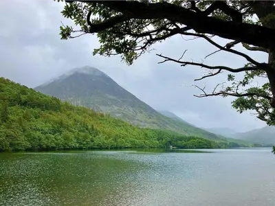 a view of a lake with a mountain in the background at Scale Hill Hotel in Loweswater