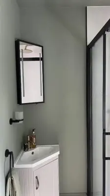 a bathroom with a white sink and a mirror at Cosy Cottage in Charming Village Close to Beach - Pass the Keys in Kirkbean