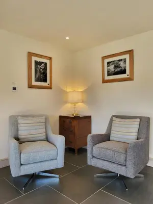 two chairs and a lamp in a living room at Wetherlam View Little Langdale in Little Langdale
