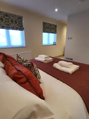 a bedroom with two beds with pillows at Wetherlam View Little Langdale in Little Langdale