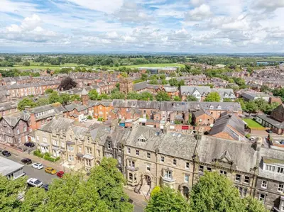 an aerial view of a city with buildings at Portland Square in Carlisle