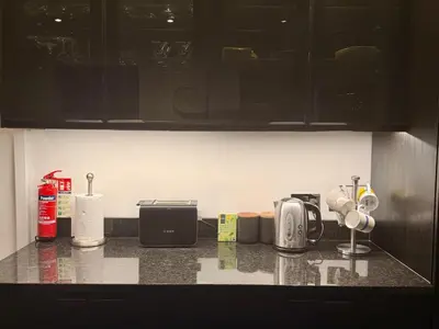 a kitchen counter with various appliances on a counter top at The old townhouse in Carlisle