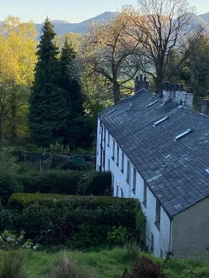 a house with a roof with solar panels on it at 3 Millbeck Cottage in Keswick